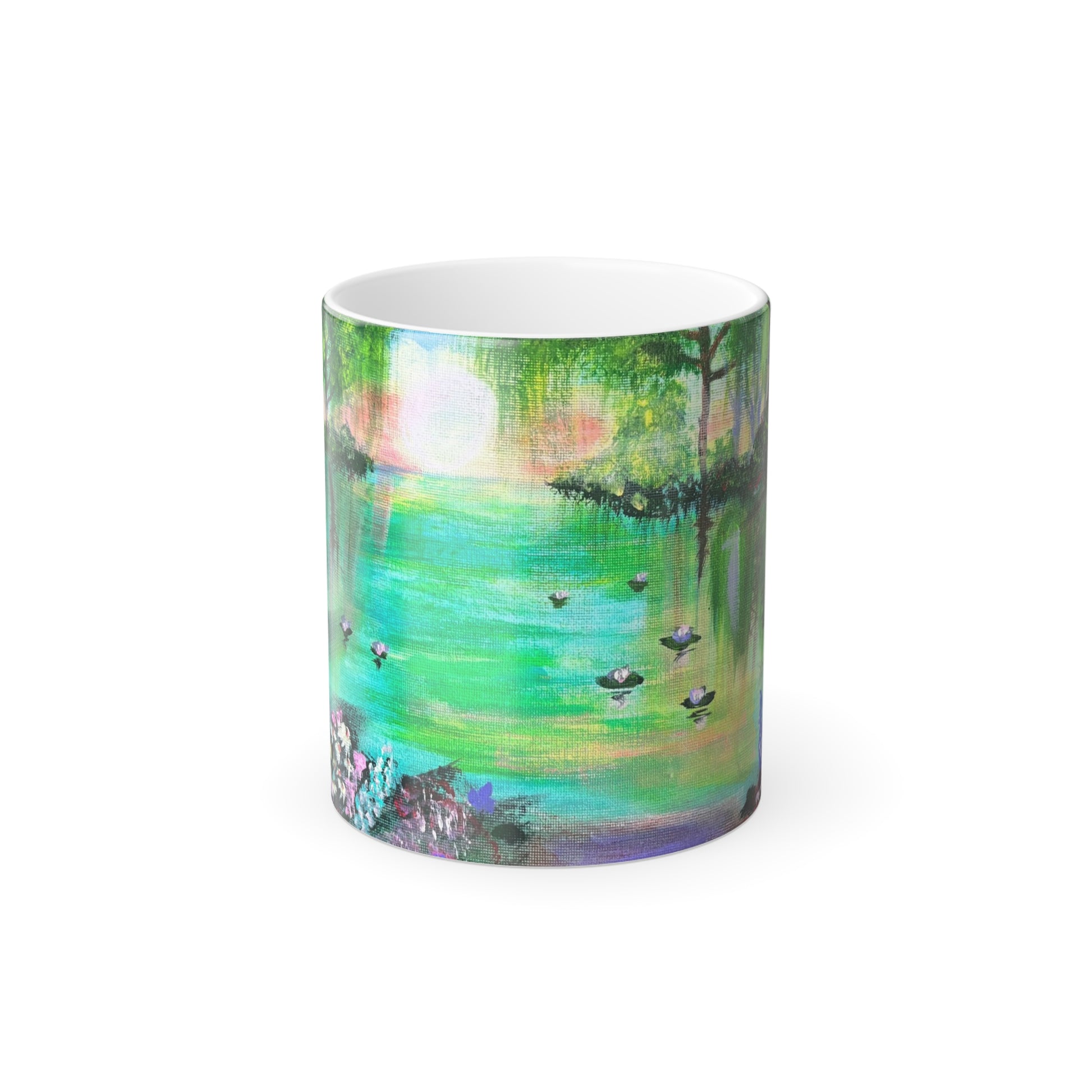 A color morphing mug with an enchanting nature scene design, featuring vibrant colors and greenery, with the ability to reveal hidden images with hot liquids.